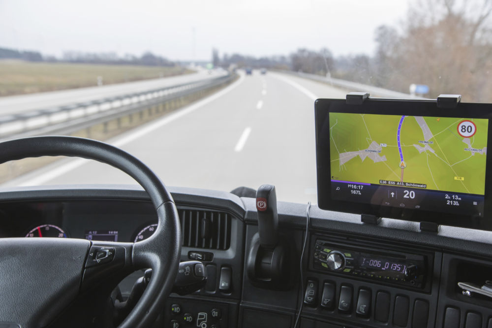 picture of the view of a highway from the drivers perspective of a semi truck