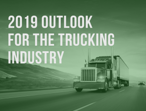 image of a semi truck driving down a highway with the text '2019 outlook for the trucking industry'