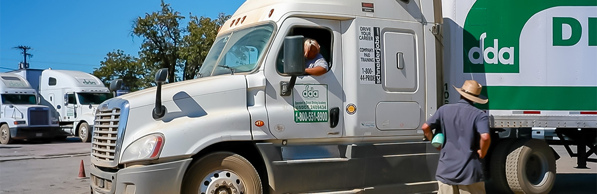 Image of DDA student behind the wheel getting instruction of vehicle manuvers during CDL Prep Training Program