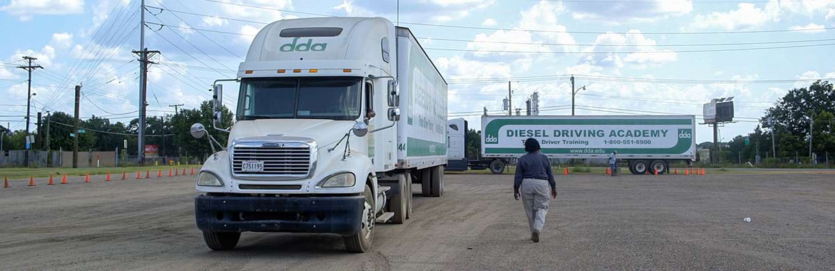 Image of full DDA truck and trailer, along with straight across trailer behind the first