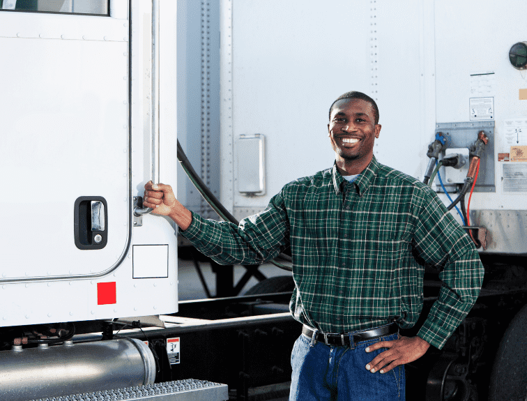 Image of truck driver standing in front of truck holding the assistance pole and following health tips