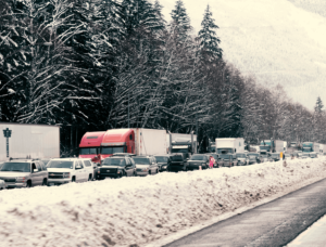 Image of winter holiday traffic with 18 wheelers and cars